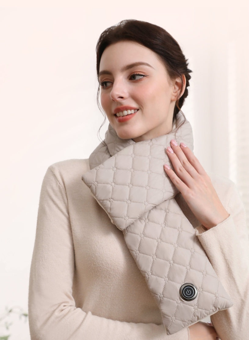 Woman wearing a beige quilted shoulder bag with a visible brand logo on a light background
