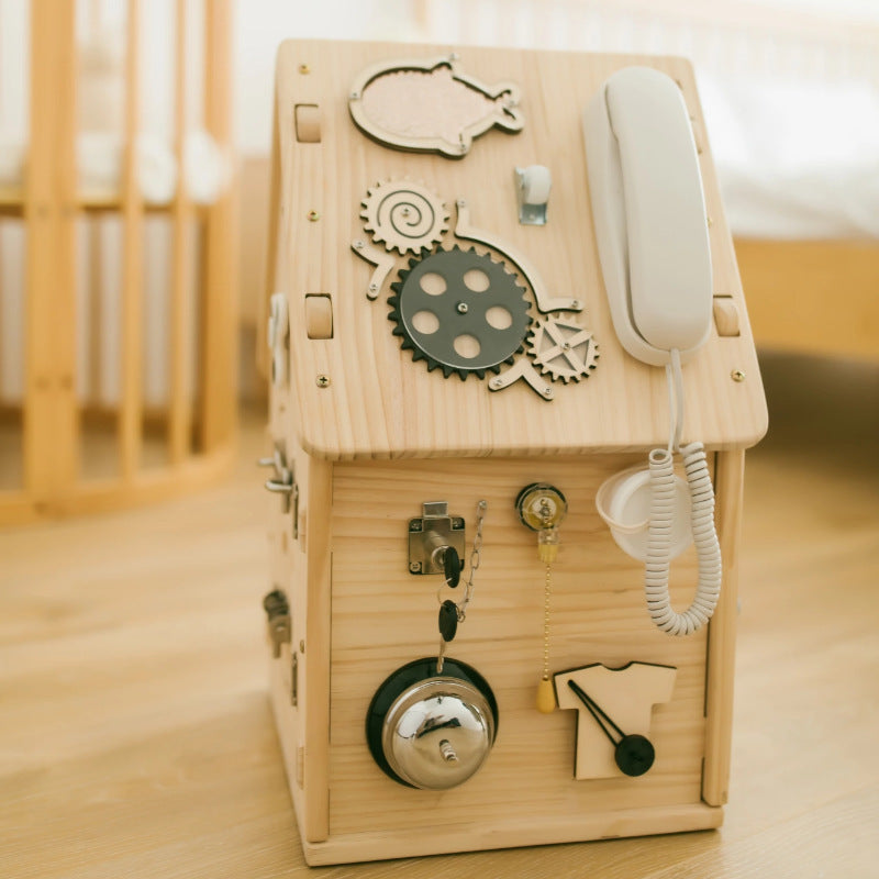 Wooden toy telephone with mechanical design on a wooden surface
