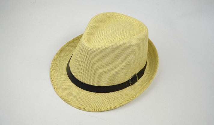 Yellow fedora hat with a black band on a light gray background