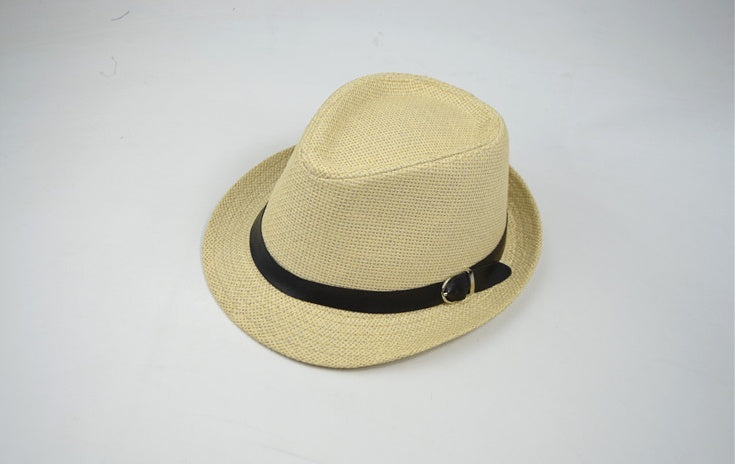 Beige straw hat with a black band on a light gray background