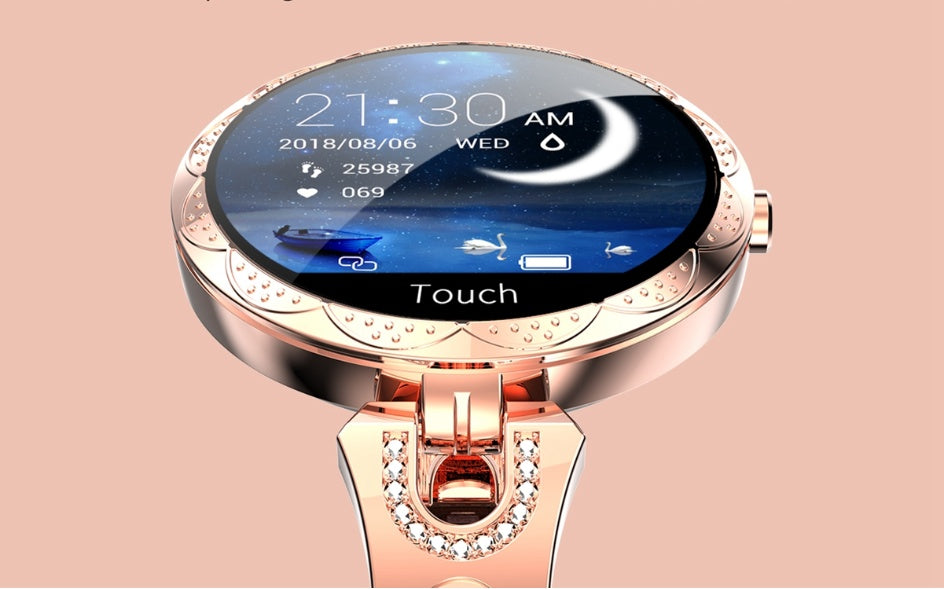 Smartwatch with a rose gold band on a pink background