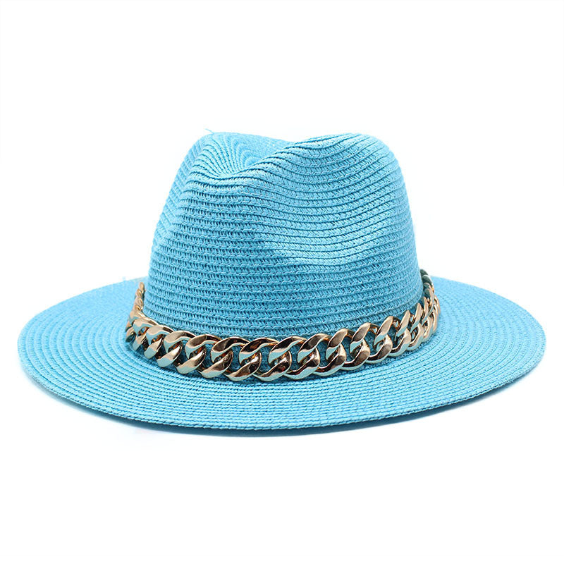 Blue straw hat with a gold chain band on a white background