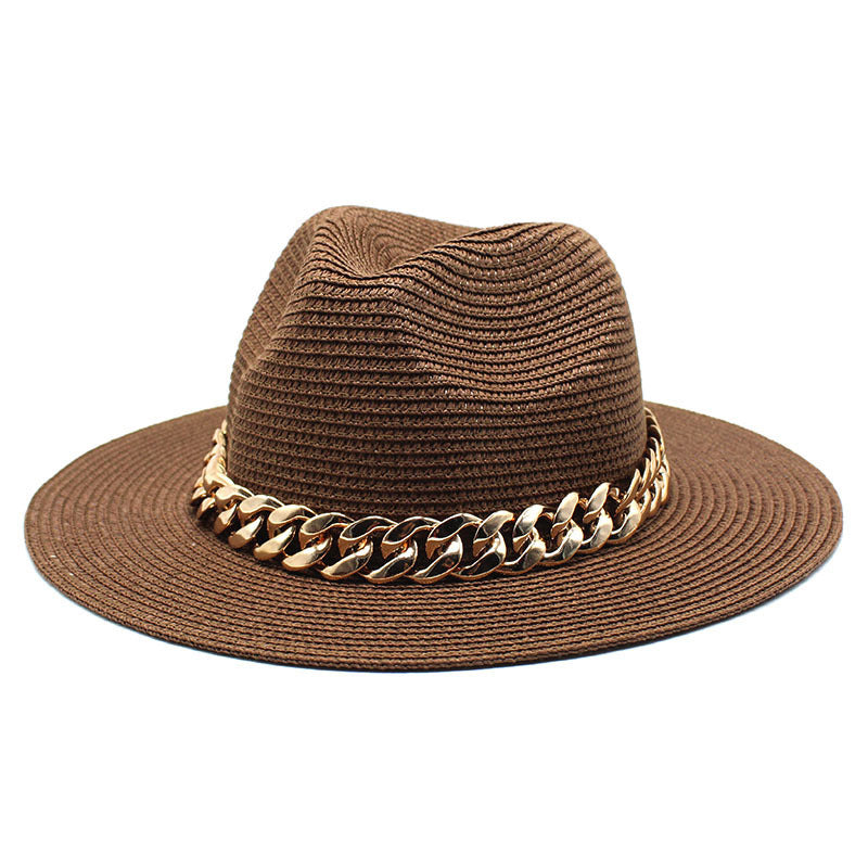 Brown straw hat with a gold chain band on a white background