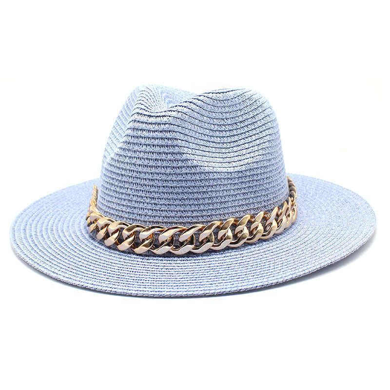 Light blue straw hat with a gold chain band on a white background