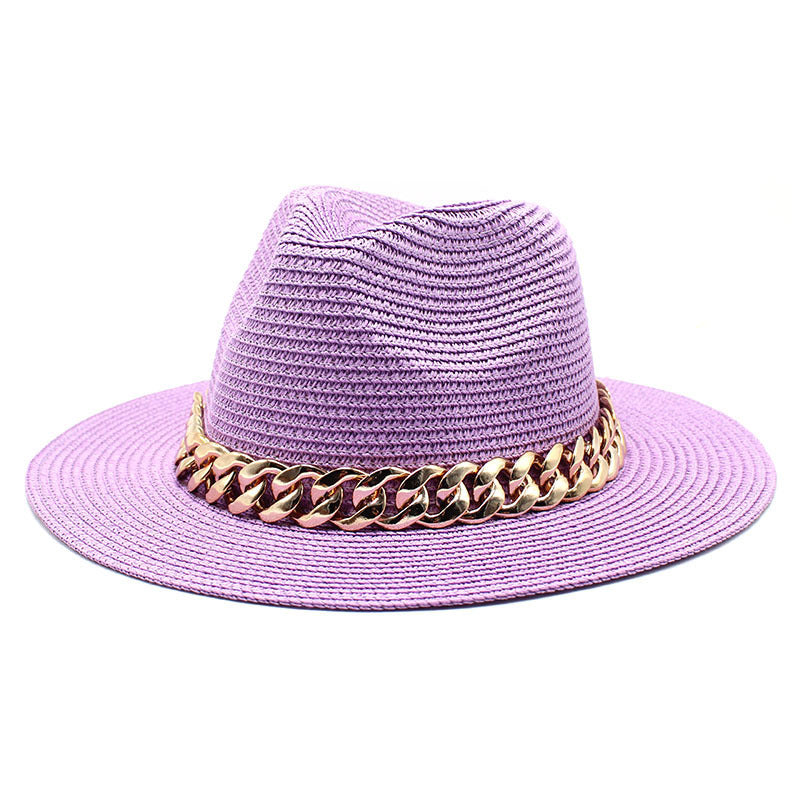 Purple straw hat with a gold chain band on a white background