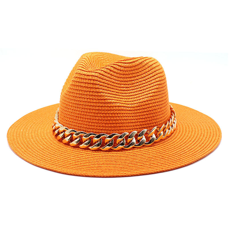 Orange straw hat with a gold chain band on a white background