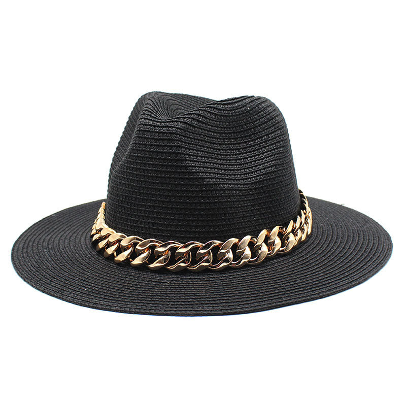 Black straw hat with a gold chain band on a white background