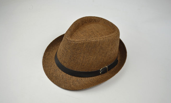 Brown straw hat with a black band on a white background
