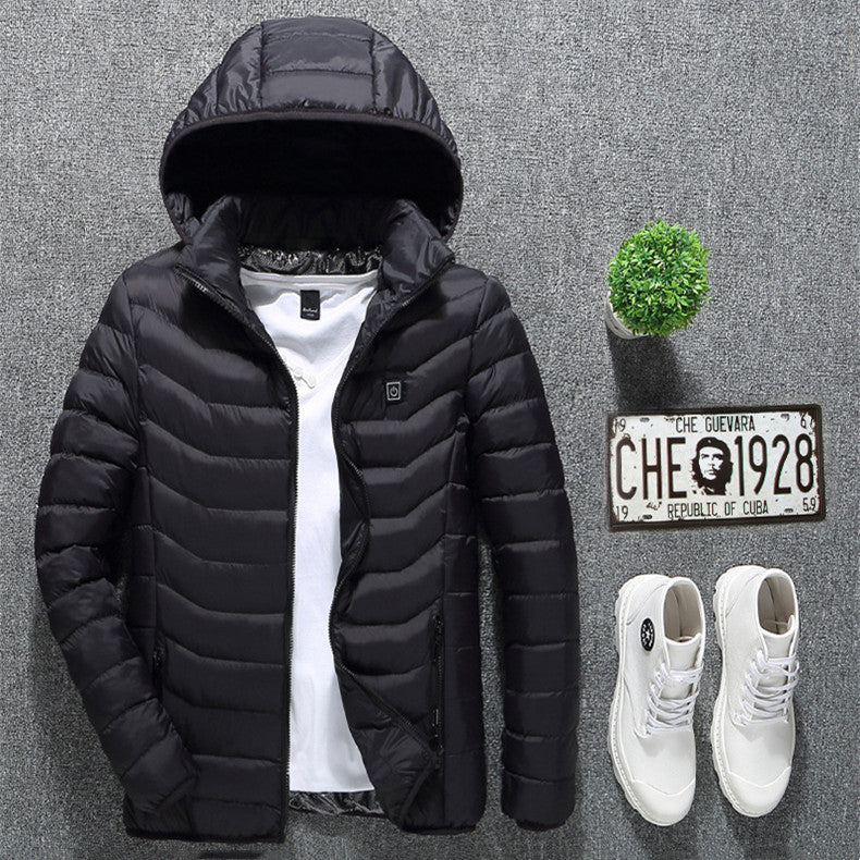 Black puffer jacket, white sneakers, and decorative items on a gray background