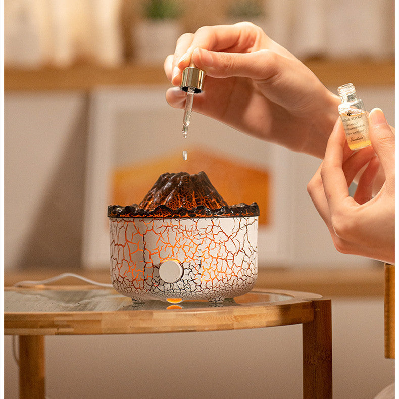 Person pouring a liquid into a decorative lamp with a cracked design.