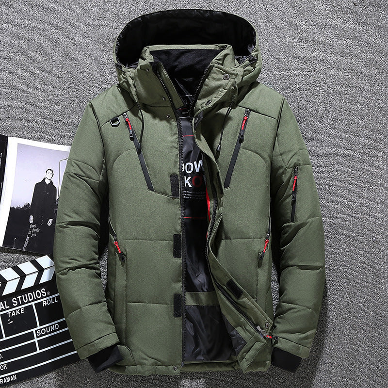 Green winter jacket with a brand label on a gray background