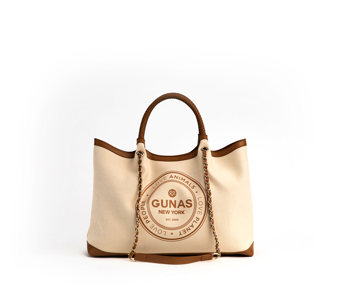 Beige handbag with brown accents and 'Gunas New York' branding on a white background