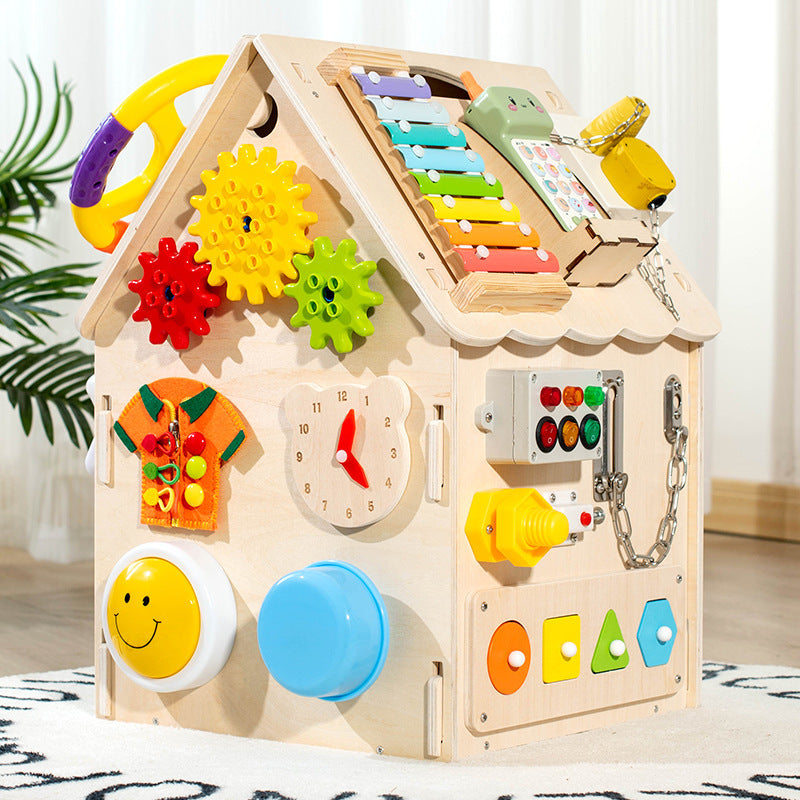 Wooden educational toy with various interactive elements on a light background