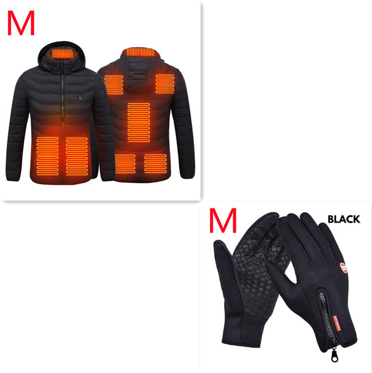Black heated jacket with orange heating elements and black gloves on a white background