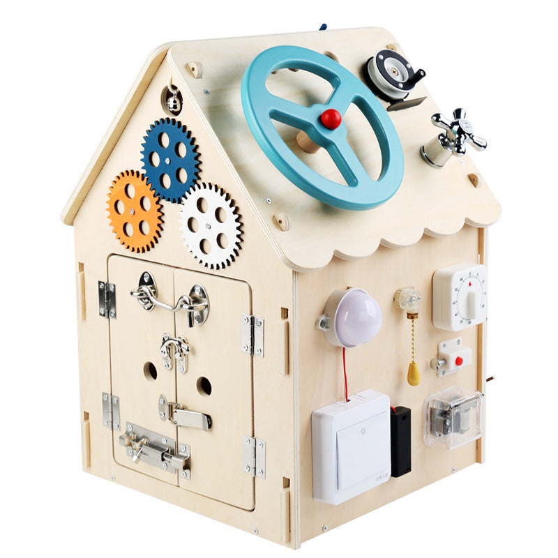 Wooden toy house with mechanical components on a white background