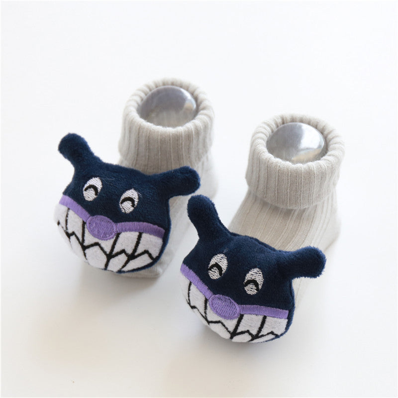 Pair of baby socks with cartoon character design on a white background