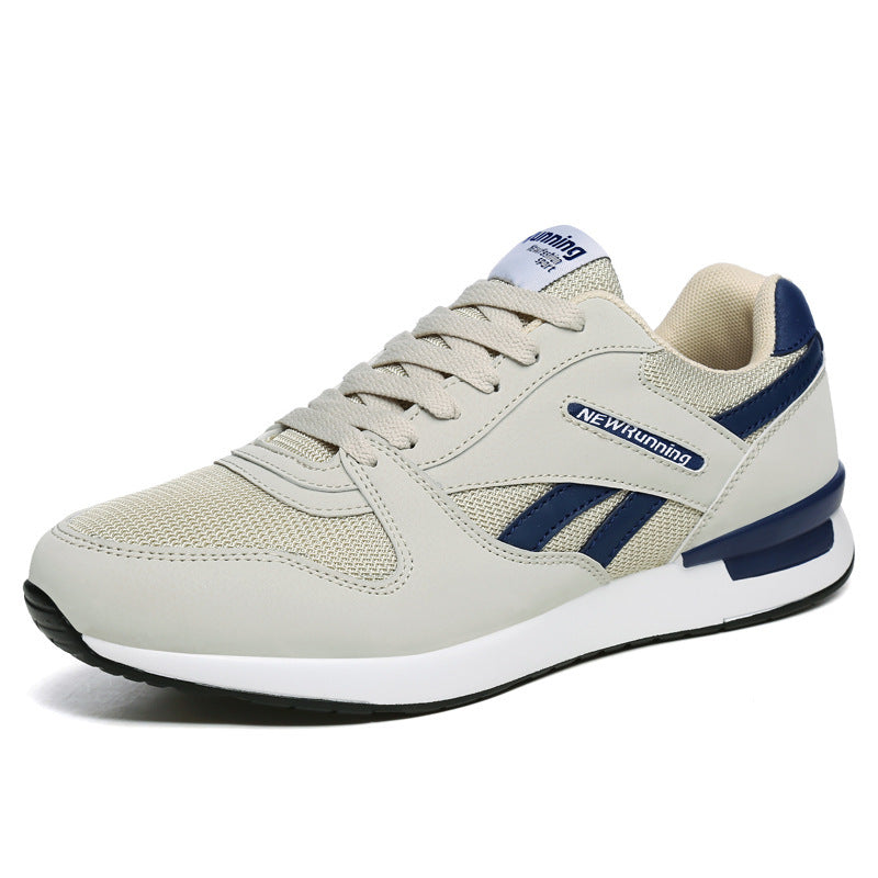 Beige running safey shoe with blue accents on a white background