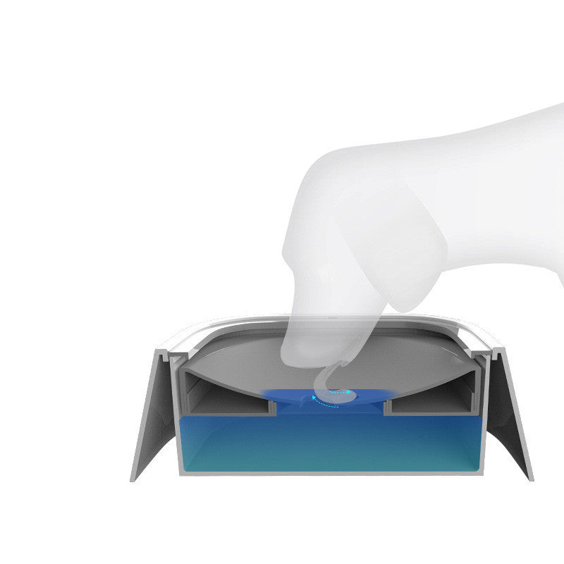 Hand pressing the tray of smart anti-spill pet water bowl with blue water inside on white background