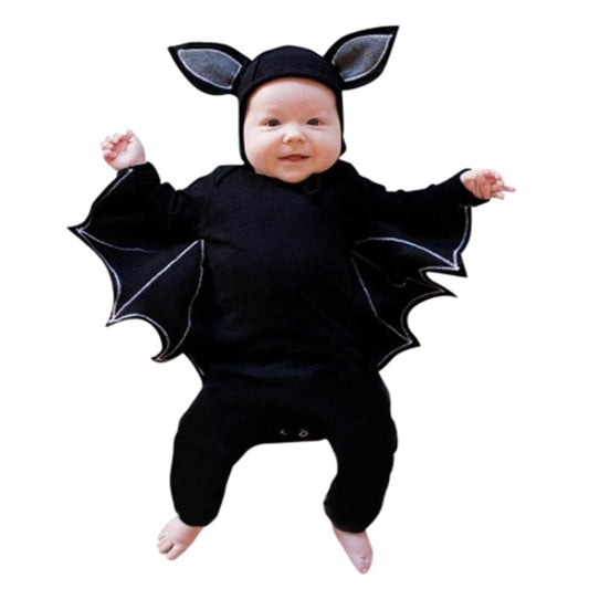 Baby in a black bat costume with wings and ears on a white background