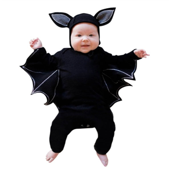 Baby in a black bat costume with wings and ears on a white background