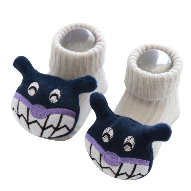 Pair of baby shark-themed socks on a white background