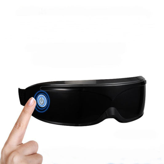 Black luxury eye massager with power button being pressed – on white background