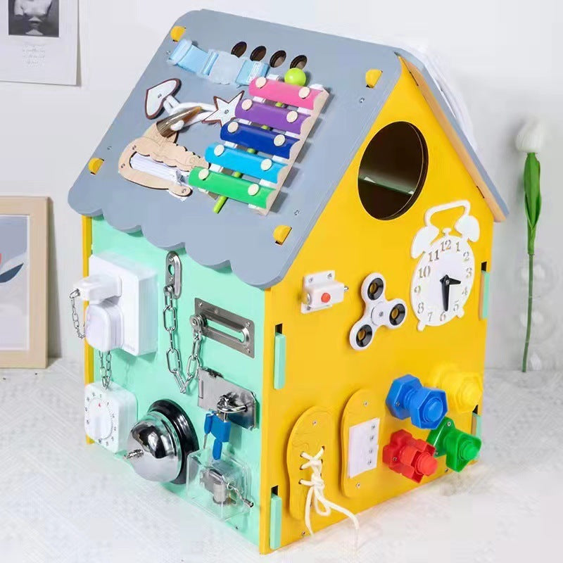 Colorful educational toy with various interactive elements on a white surface.