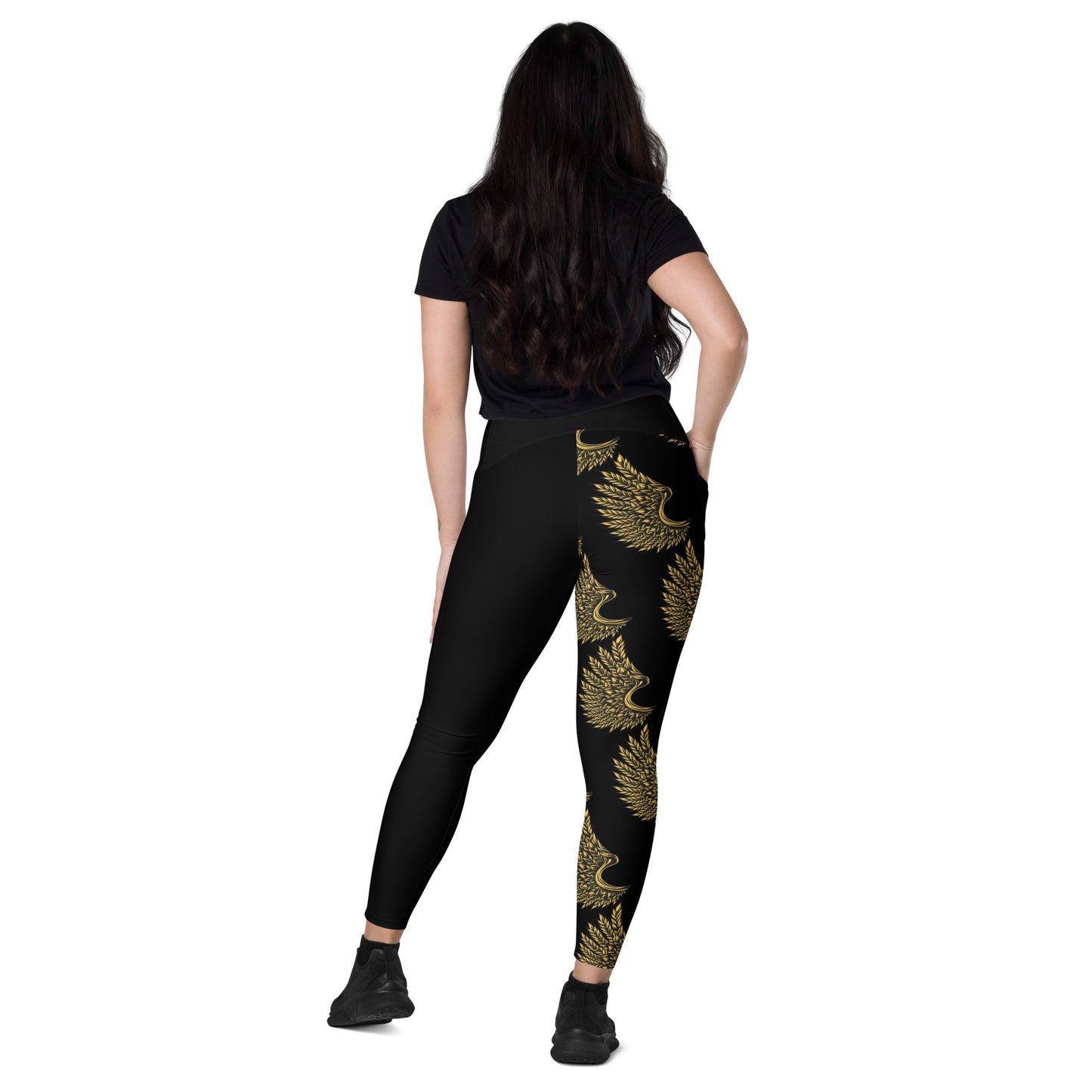 Rear view of high-waisted crossover leggings with golden crane print visible from behind
