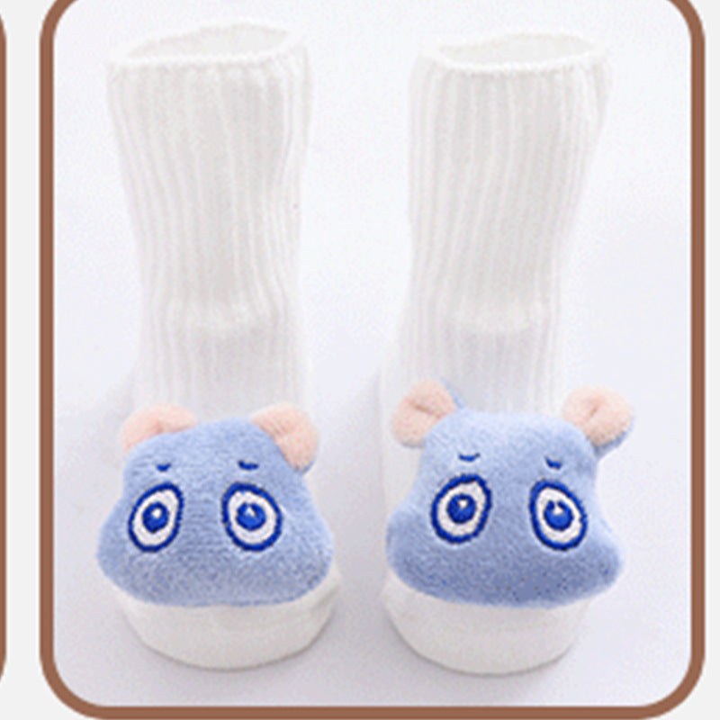 Pair of white socks with blue animal face designs on a white background