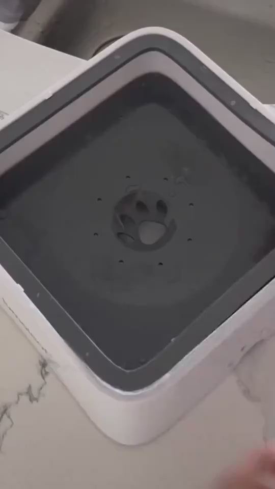 Top view of circulating pet water fountain on marble counter